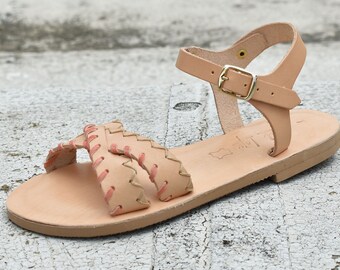 natural leather woman sandal with orange decoration
