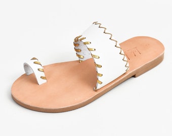 white leather woman sandal with gold decoration