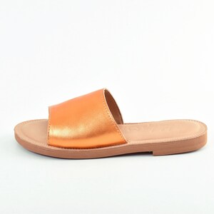 Orange metallic leather woman flast sandal
