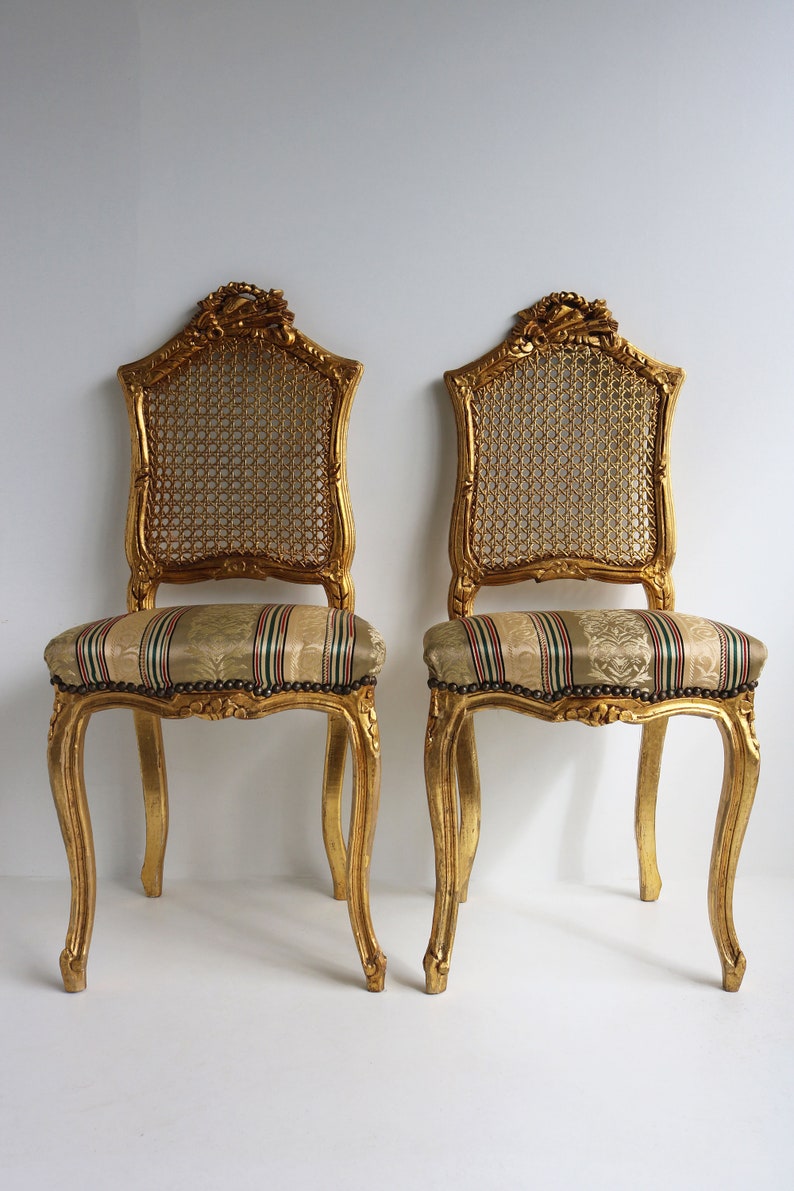 couplepair Midcentury decorative wooden gold painted woodcarvedchairs webbing back french louis style