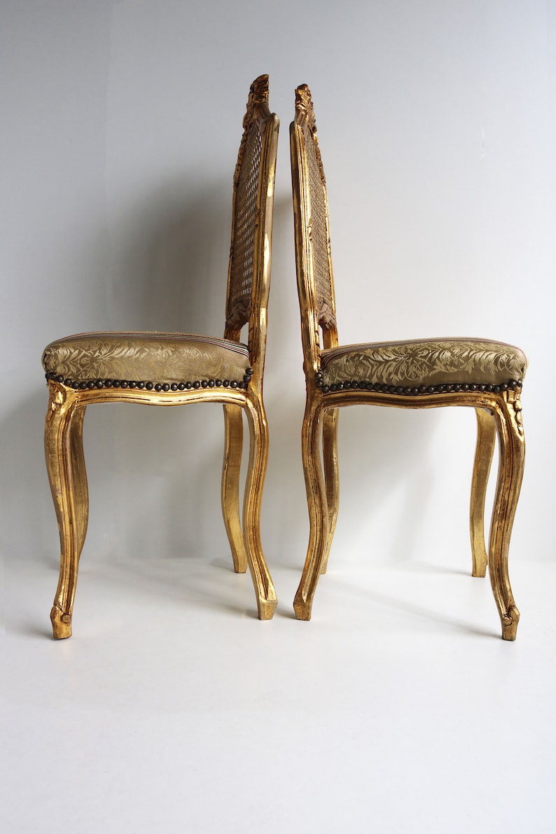 couplepair Midcentury decorative wooden gold painted woodcarvedchairs webbing back french louis style