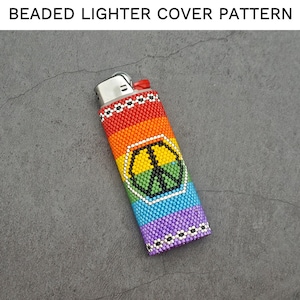 May include: A rainbow beaded lighter cover with a peace sign design. The cover is made with small, colorful beads and features a white peace sign with a green outline.