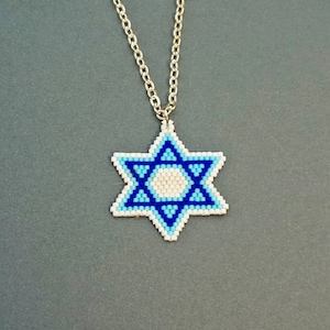 May include: A silver chain necklace with a blue and white beaded Star of David pendant.