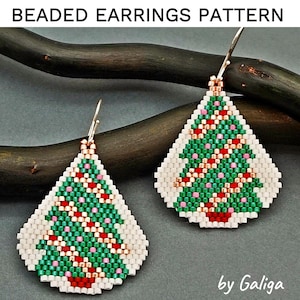 May include: A pair of beaded Christmas tree earrings with green, red, white, and gold beads. The earrings are in the shape of a teardrop and have a silver hook.