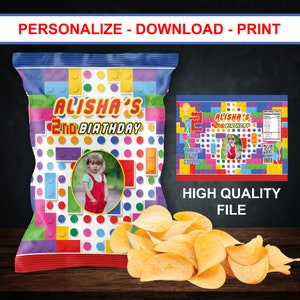 May include: A colorful chip bag with a Lego-themed design. The bag features a photo of a child and the text "Alisha's 2nd Birthday".