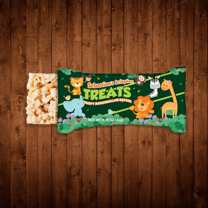 Puede incluir: Un paquete verde y marr&oacute;n de "Sebastian's Krispies Treats" cuadrados de malvavisco crujientes. El paquete presenta una variedad de animales de dibujos animados, incluyendo una jirafa, una cebra, un le&oacute;n, un elefante y un mono. El paquete es de 0,78 oz (22 g).