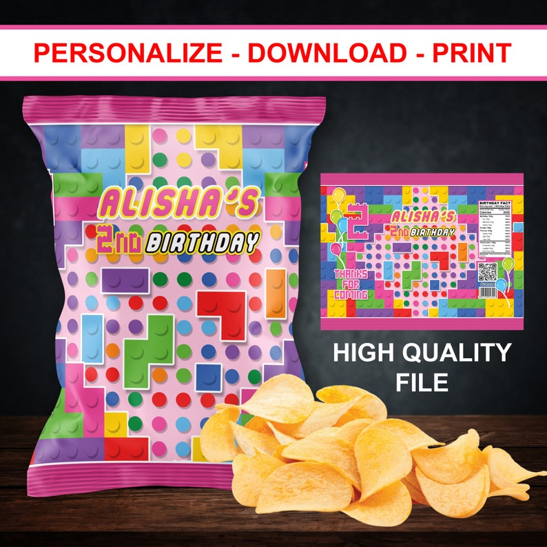 May include: A pink and colorful chip bag with a Lego-themed design. The bag says "Alisha's 2nd Birthday".