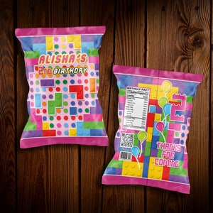 May include: Pink and colorful chip bag with a Lego theme. The front of the bag says "Alisha's 2nd Birthday". The back of the bag has a birthday fact and says "Thanks for coming".
