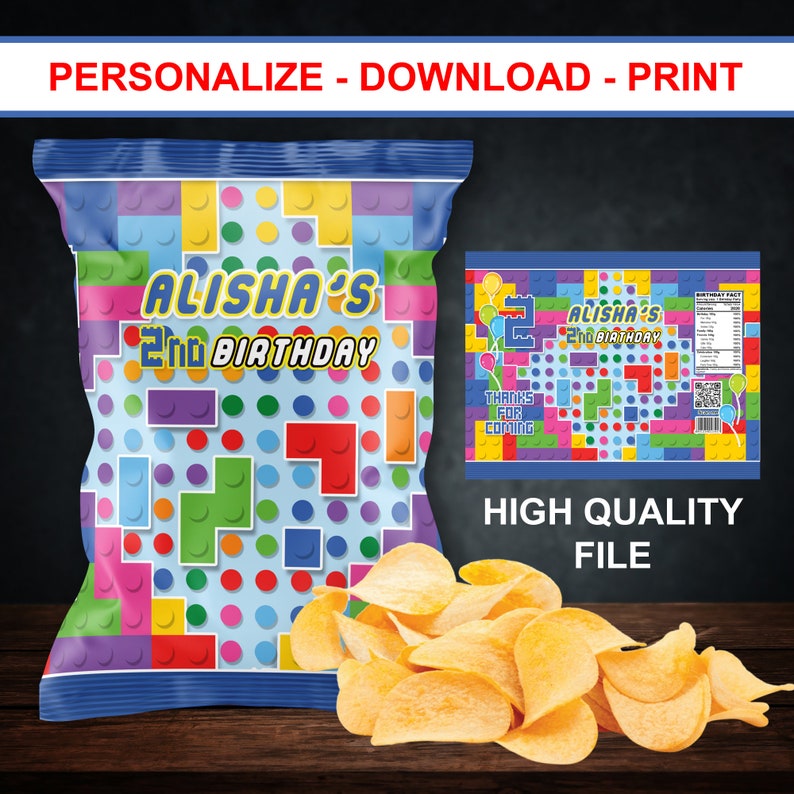 May include: A blue and white chip bag with a colorful Lego-themed design. The bag says "Alisha's 2nd Birthday".
