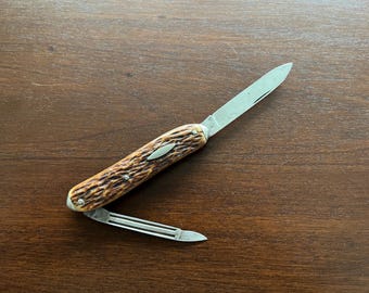 R6243 Remington Etched serpentine lobster pocket knife