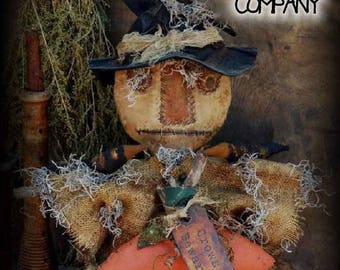 May include: A handmade scarecrow doll with a black hat, burlap clothing, and a sign that reads "Crows Beware".