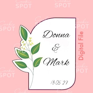 May include: A white arch-shaped sign with a dark outline featuring a green leafy branch with yellow buds on the left side. The text reads Donna & Mark with the date 13 05 27 below. The background is light pink with repeating Cookie Spot text.