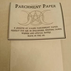 May include: A packet of parchment paper, labelled "PARCHMENT PAPER". The label states "8 SHEETS OF 90GSM PARCHMENT PAPER. PERFECT FOR USE IN SPELLWORK, WRITING DOWN WISHES AND SPECIAL NOTES. MADE IN THE UK."