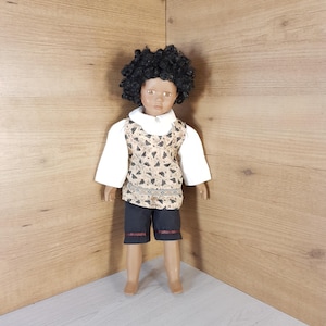 Vintage porcelain doll, Old doll, Vintage collectible doll, Beautiful doll, Hand-painted doll, Black hair and has the original outfit.