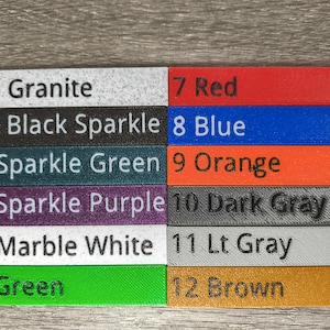 May include: A color swatch chart featuring twelve rectangular samples. The colors include Granite, Black Sparkle, Sparkle Green, Sparkle Purple, Marble White, Green, Red, Blue, Orange, Dark Gray, Lt Gray, and Brown. Each sample is labeled with a number and color name.