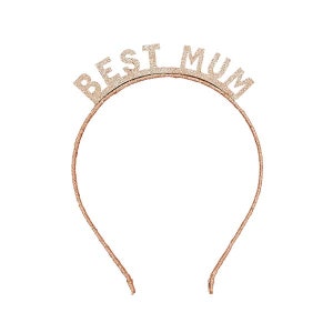 May include: A rose gold glitter headband with the words "BEST MUM" across the top. The headband is a thin, simple design, perfect for a special occasion or gift.