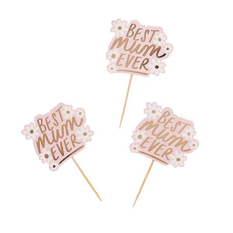 May include: Three pink cupcake toppers with the text "BEST MUM EVER" in gold script. The toppers are shaped like a flower and have small white flower accents. Each topper has a wooden stick.