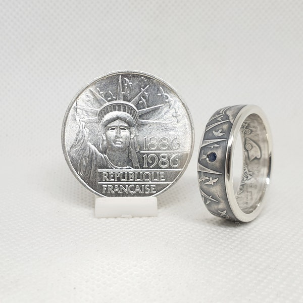 Bague pièce de monnaie 100 Francs "Statue de la liberté" en argent serti d'un saphir (coin ring)