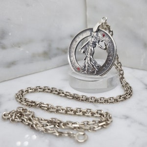 Pendant coin 5 Francs &quot;Sower&quot; in hand-cut silver set with two rubies.