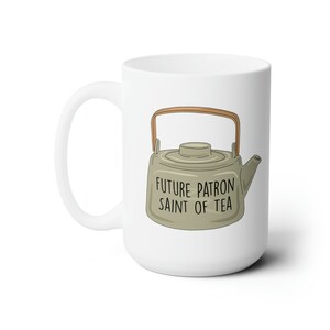 May include: White ceramic mug with a green teapot illustration and the text "Future Patron Saint of Tea".