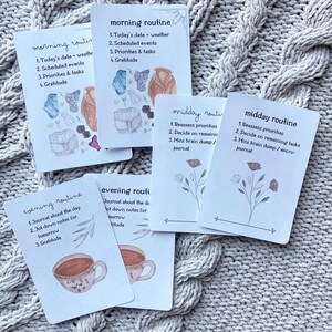 May include: Five illustrated cards with a daily routine theme. Each card has a watercolor illustration and text. The cards are titled "morning routine", "midday routine", "evening routine", "morning routine", and "midday routine".