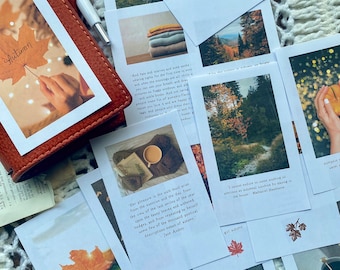 May include: A collection of autumn-themed printable cards with images and quotes about the season. The cards feature fall foliage, cozy sweaters, and a cup of coffee. The text includes quotes about autumn from Jane Austen and Nathaniel Hawthorne.