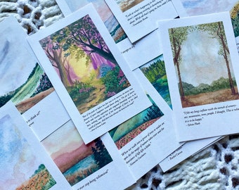 May include: A set of cards with watercolor illustrations of nature scenes and inspirational quotes. The quotes include: "There is some good in this world, and it's worth fighting for." - J.R.R. Tolkien, "Look at what's happening in the world. Every day there's something exciting or devastating to write about. Which is what I'm trying to do, here, as I try..." -  Gwendolyn Brooks, "I fit my long refuge with the memory of trees, mountains, rivers, people. I thought, This is what it is to be happy." - Sylvia Plath, "But if the paths before her just now were in danger, her future happiness would be in no less danger. The poverty of means, the suppression of her natural impulses, the heavy work and worldly cares, would all conspire to rob her of a world of dreams. And there was her love for the beauty of a world of nature. Did she not always bend to the road that led her to it?" -  How Green Was My Valley, "When we walk into a grove of trees or under an open sky, the magic of nature takes us and the heaviness of life lifts a little." - Natasa Cazan, "Not every step being whimsical"