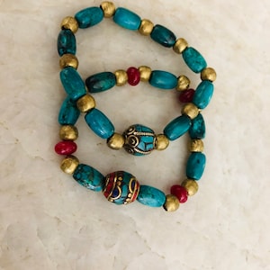 Colorful beaded stretchy bracelets of various stones :turquoise, lapis, coral , carnelian, chrysoprase and brass beads