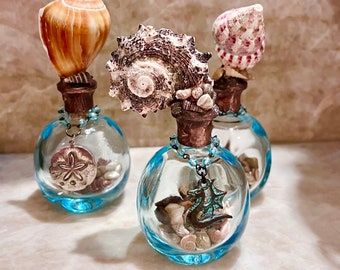 Decorated Bottle with Shell Rosary Chain Sea Dragon Charm full of Tiny Sea shells