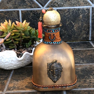 Decanter decorated with turquoise stones, Indian Chief, horseshoe, leather and tassel