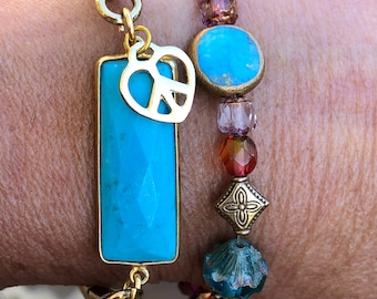 Turquoise bracelet on an unusual 10k Gold fill Stretchy Watchband with dark leather insets and gold heart peace charm