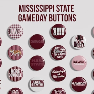 May include: A collection of round pin-back buttons featuring maroon and white designs with text including Mississippi State Gameday Buttons, Hail State, Dawgs, More Cowbell, Get Up Dawgs It's Game Day, Saturdays in Starkville, and Who Let The Dawgs Out.