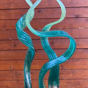 Hand made hand blown glass, garden art yard art, turquoise with light green tips.