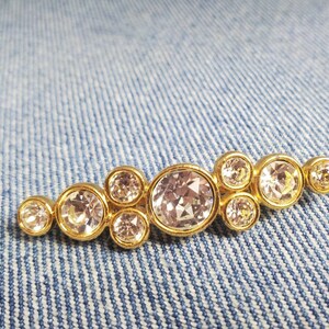 Spilla napier vintage tono oro bar con strass sfaccettati