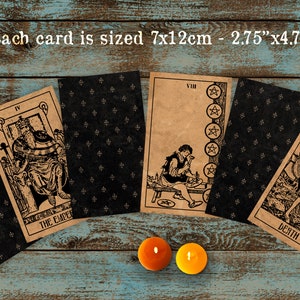 May include: A set of tarot cards with black and brown backgrounds. The cards feature illustrations of a king on a throne, a man working with tools, and a skeletal figure with a scythe. The text on the cards reads "IV THE EMPER", "VIII", and "DEATH". Each card is 2.75 inches by 4.72 inches.