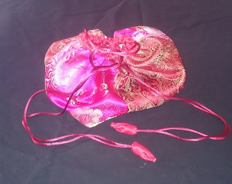 Red and magenta brocade drawstring bag