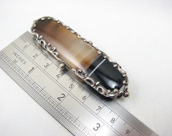 Antique Victorian Long Dark Banded Agate Mourning Brooch, white metal scroll Frame, Late 19th Century, ( approx 7.5 cm Wide)