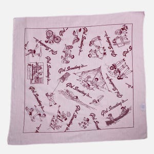 May include: A light pink square bandana with a repeating pattern of line drawings depicting various outdoor activities. The phrase "Girl Scouting is..." is written in a cursive font throughout the design.