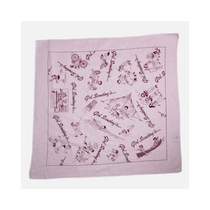 May include: A square, light pink bandana with a repeating pattern of line drawings depicting various outdoor activities. The phrase "Girl Scouting is..." is written in a repeating pattern around the edges of the bandana.