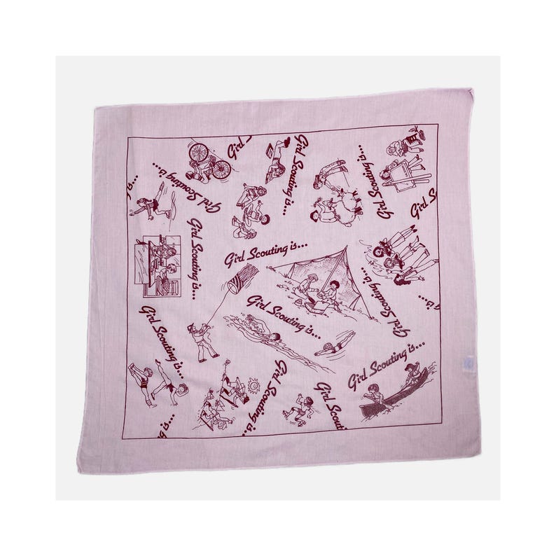 May include: A square, light pink bandana with a repeating pattern of line drawings depicting various outdoor activities. The phrase "Girl Scouting is..." is written in a repeating pattern around the edges of the bandana.
