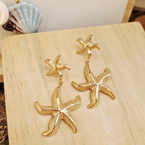 Gold Starfish Dangle Earrings in Stainless Steel