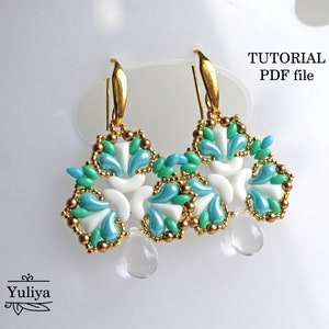 May include: A pair of gold earrings with a white and blue beaded design. The earrings are shaped like a flower with a teardrop-shaped crystal hanging from the bottom. The image includes the text "TUTORIAL PDF file".