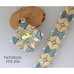 May include: A beaded pendant and bracelet set with a crystal center, featuring a design of white and blue beads. The pendant is hanging from a silver chain on a wooden surface. The text "TUTORIAL PDF file" is below the pendant.