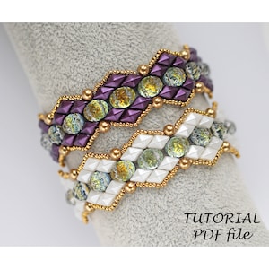 May include: Two beaded bracelets with a chevron pattern. The top bracelet is purple and gold, and the bottom bracelet is white and gold. Both bracelets have iridescent green beads. The image includes the text "TUTORIAL PDF file".