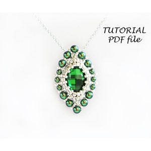 May include: A green and silver beaded pendant with a large green gemstone in the center. The pendant is attached to a silver chain. The image includes the text "TUTORIAL PDF file".
