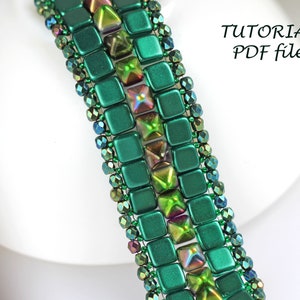 May include: A green and iridescent beaded bracelet with a square and pyramid bead pattern. The bracelet is on a white surface with the text "TUTORIAL PDF file".