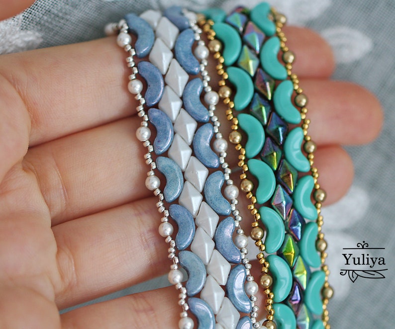May include: Four beaded bracelets in shades of blue, turquoise, and gold. The bracelets are made with small, round beads and feature a variety of patterns.
