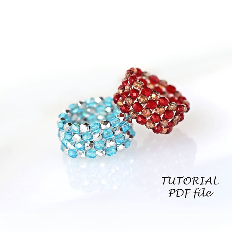 May include: Two beaded rings, one red and one blue, on a white background. The text "TUTORIAL PDF file" is below the rings.