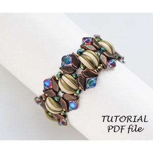 May include: A beaded bracelet with a leaf and striped bead design in shades of brown, green, and blue. The bracelet is made with seed beads and has a metallic finish. The image includes the text "TUTORIAL PDF file".