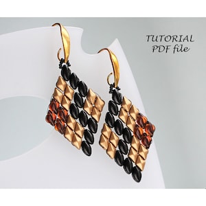 May include: A pair of gold and black beaded earrings with a diamond shape. The earrings are made with small, round beads and have a gold hook closure.